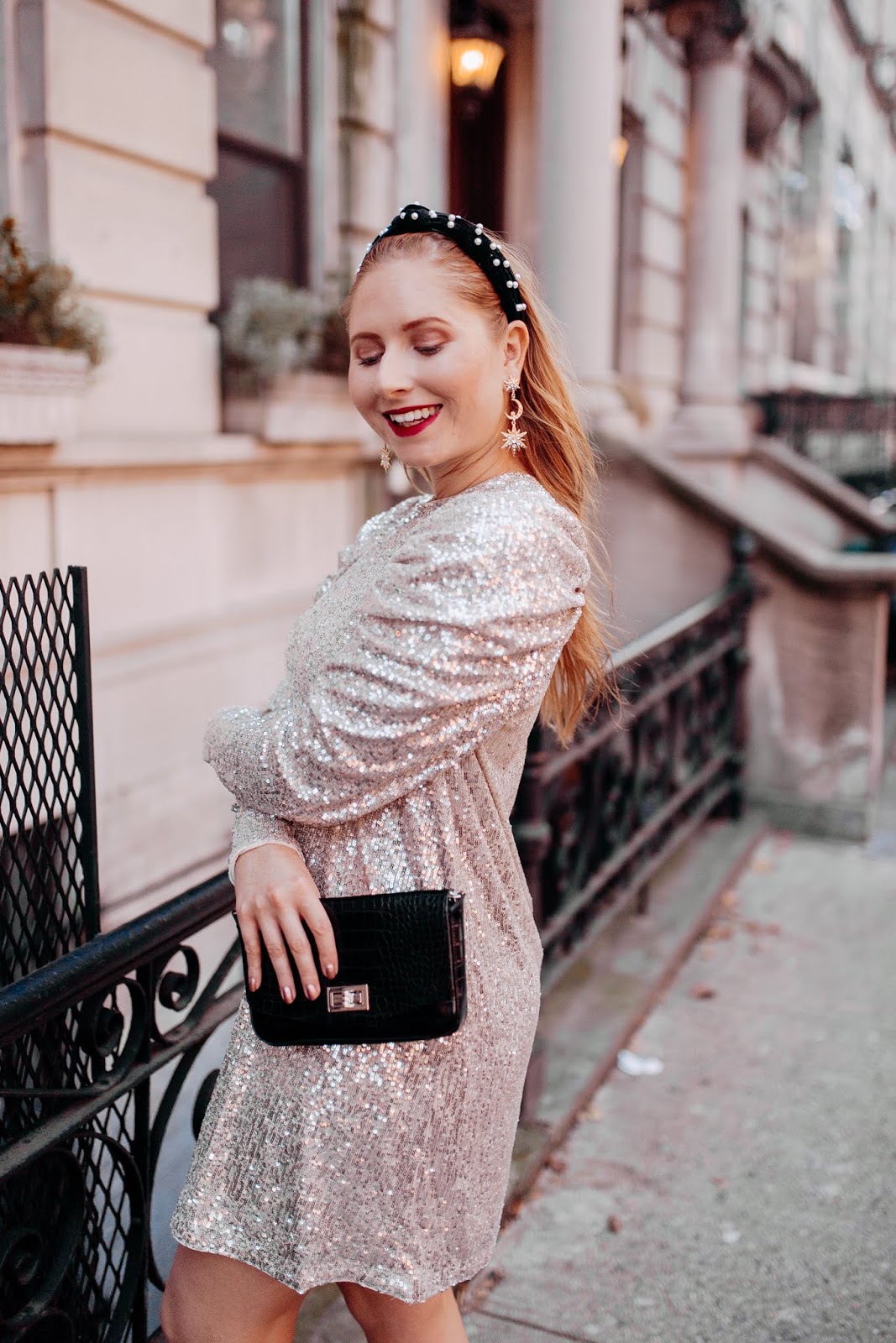 Holiday Party Dresses and Christmas Outfit Ideas - Affordable by Amanda wears a sequined silver dress from H&M in New York City