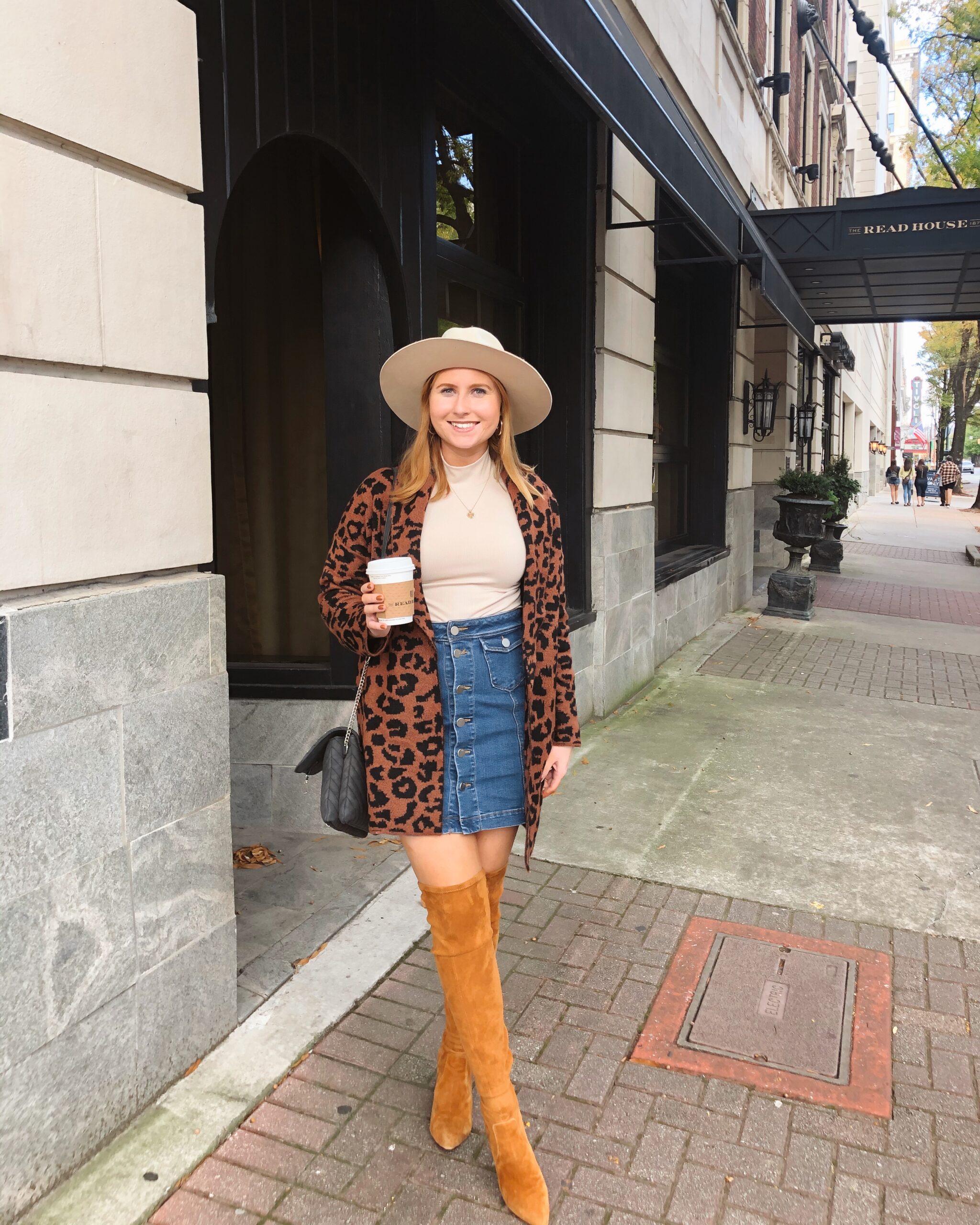Time and Tru Women's Shawl Collar Cardigan Sweater - Walmart Fashion Finds. Affordable by Amanda wears denim mini skirt, brown suede boots, leopard cardigan and a tan hat at the Read House Hotel in Chattanooga, TN.