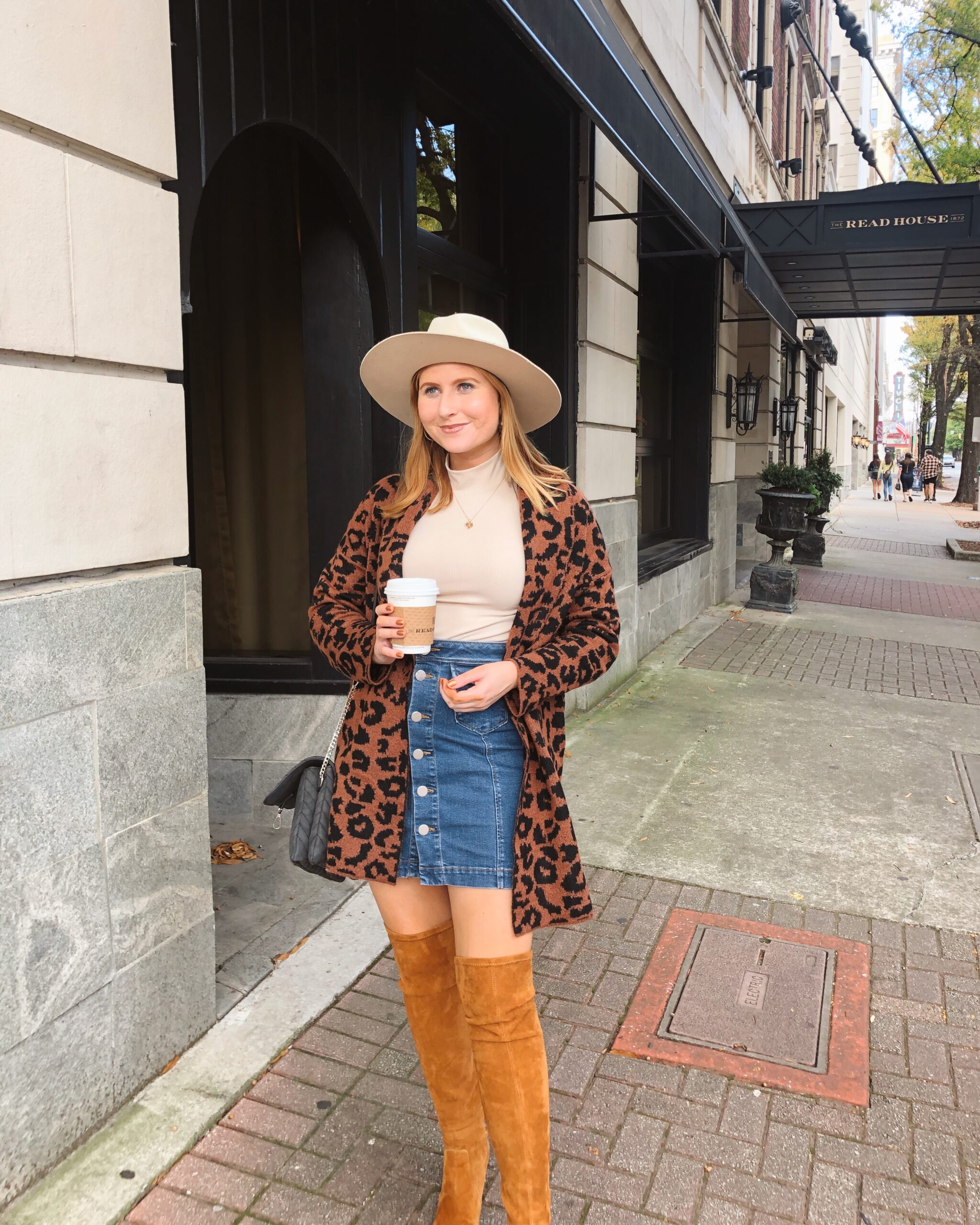Time and Tru Women's Shawl Collar Cardigan Sweater - Walmart Fashion Finds. Affordable by Amanda wears denim mini skirt, brown suede boots, leopard cardigan and a tan hat at the Read House Hotel in Chattanooga, TN.