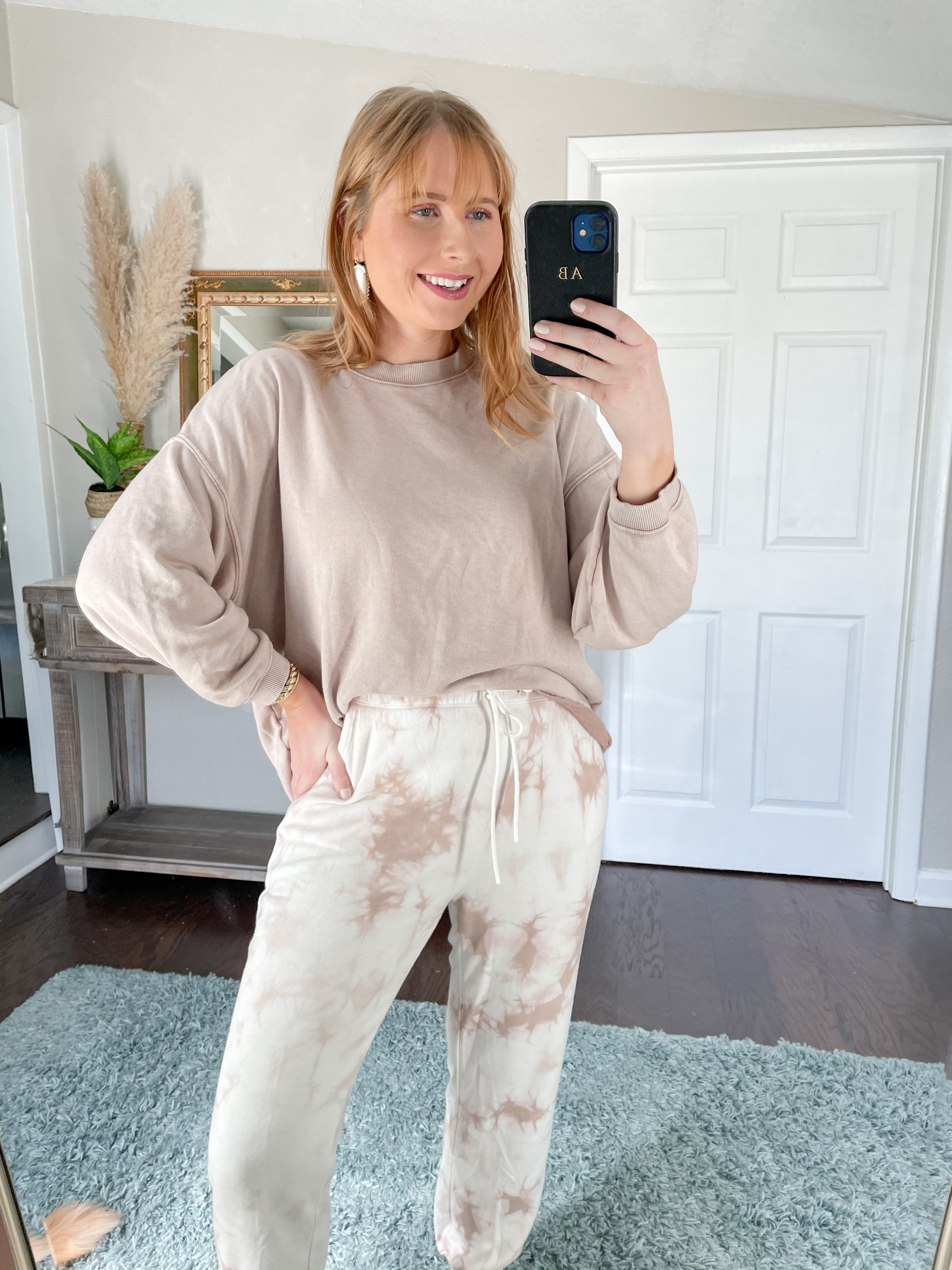 Womens New Arrivals Clothing - Women's Clothing - Walmart.com | Affordable by Amanda wears a brown sweatshirt and light brown tie-dye joggers.