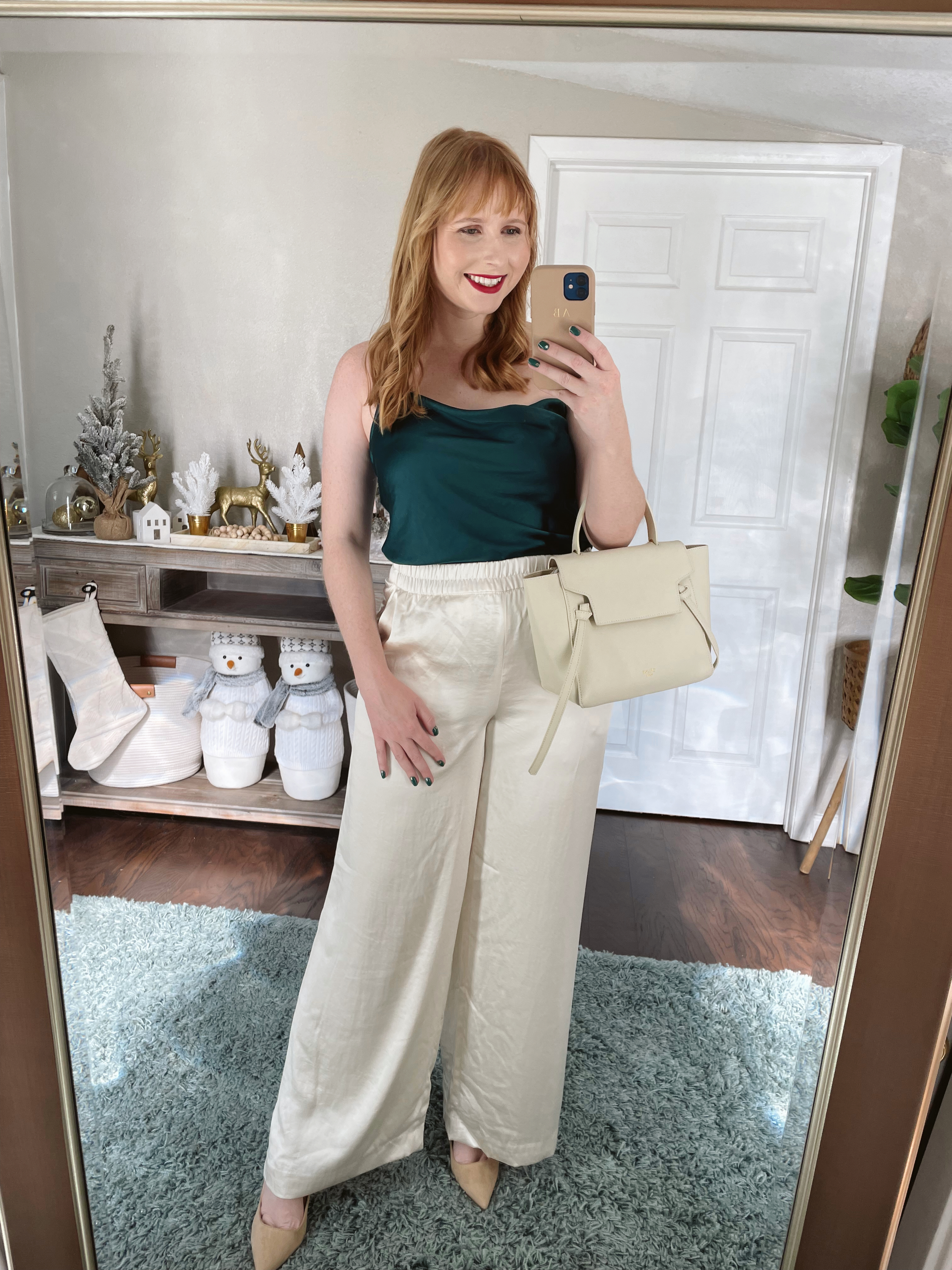Affordable by Amanda wears a green Rhinestone Strap Satin Cowl Neck Cami and High Waisted Luxe Satin Wide Leg Pant . Express Holiday Outfits 2021. Express Winter Try On Haul 2021. Express Sequin & Sparkle.