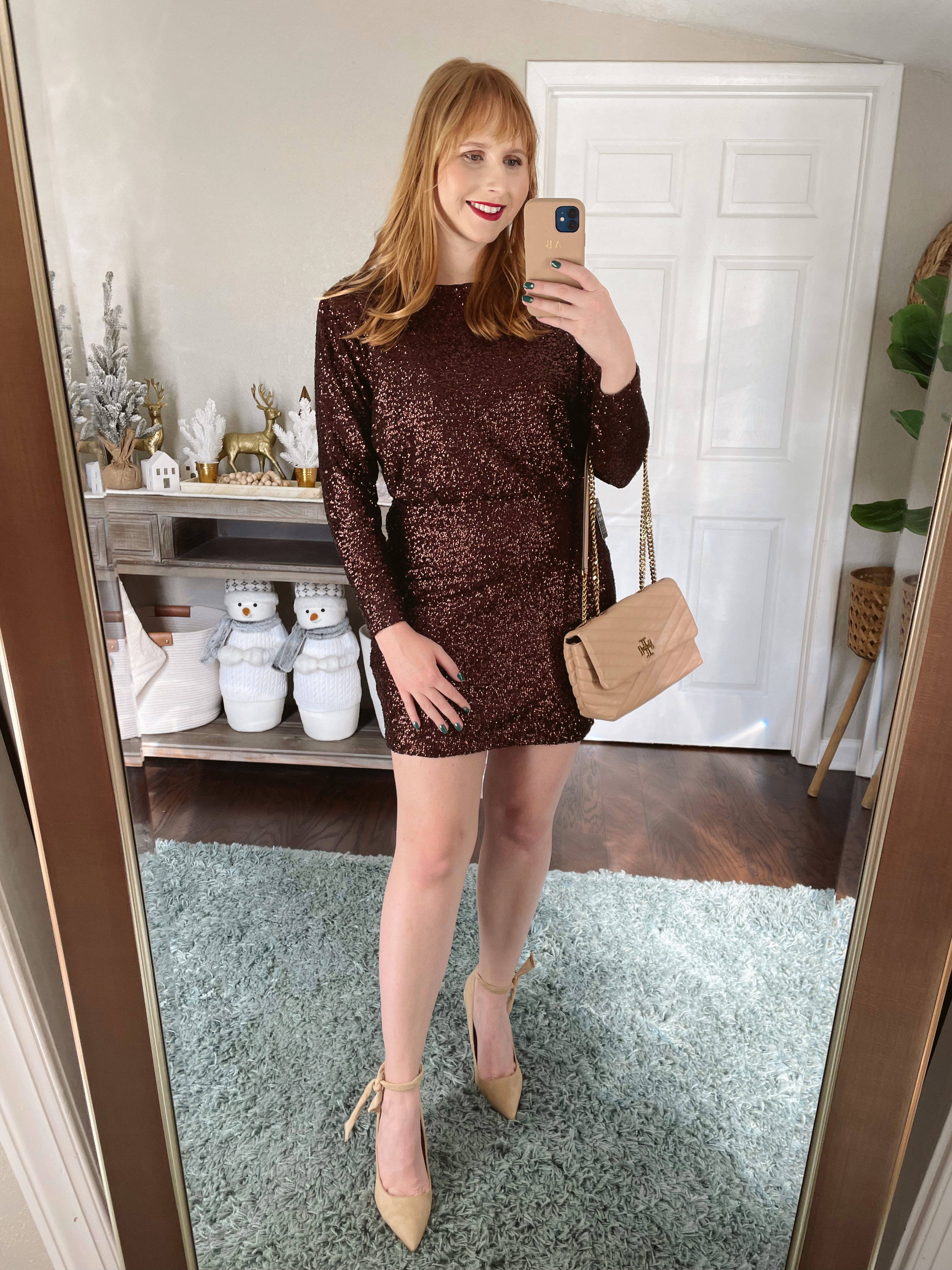Affordable by Amanda wears a chocolate brown Sequin Strong Shoulder Mini Dress by Express. Express Holiday Outfits 2021. Express Sequin & Sparkle.