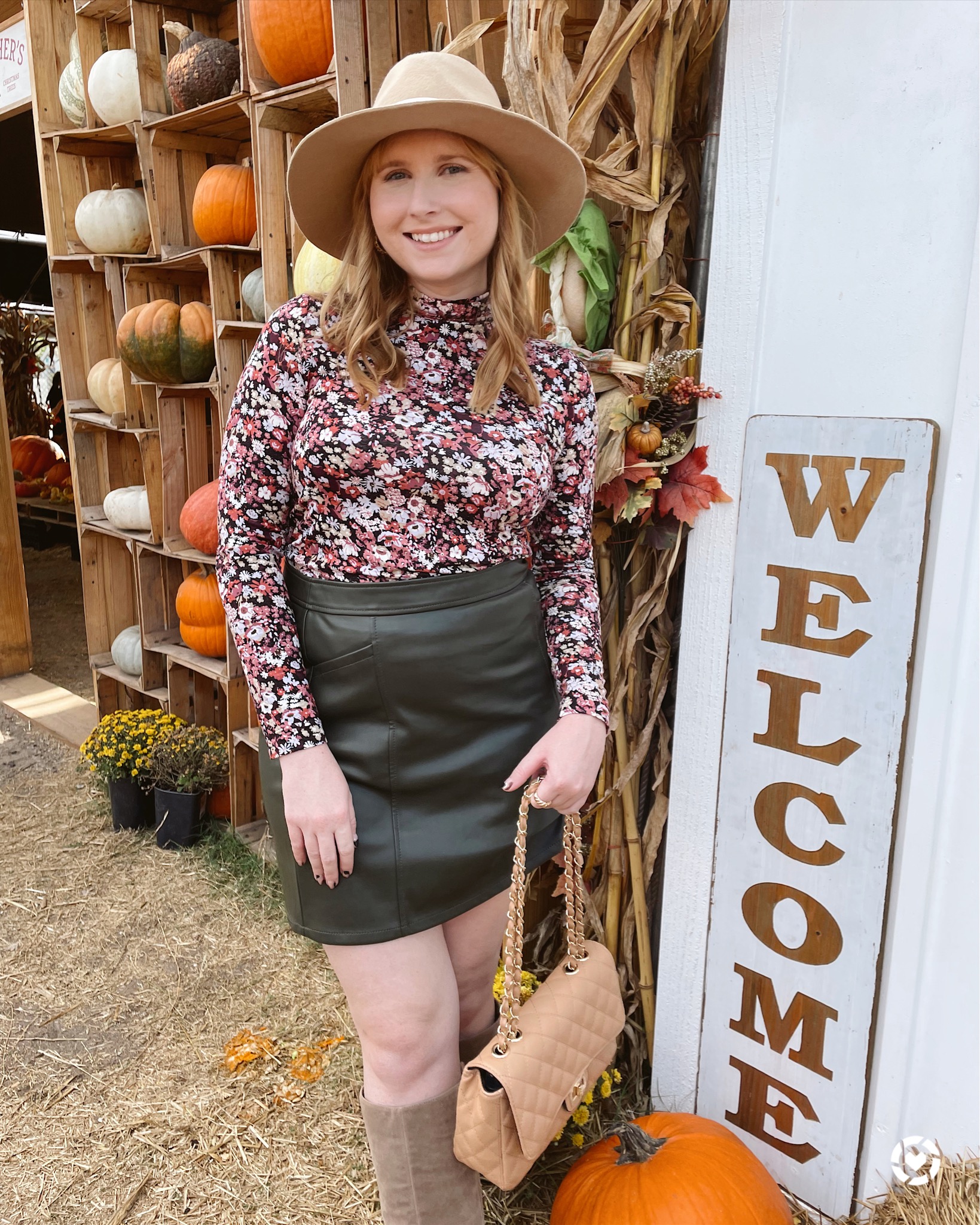 Affordable by Amanda wears LOFT Floral Mock Neck Long Sleeve Tee and Green Faux Leather Mini Skirt at the Pumpkin Patch 