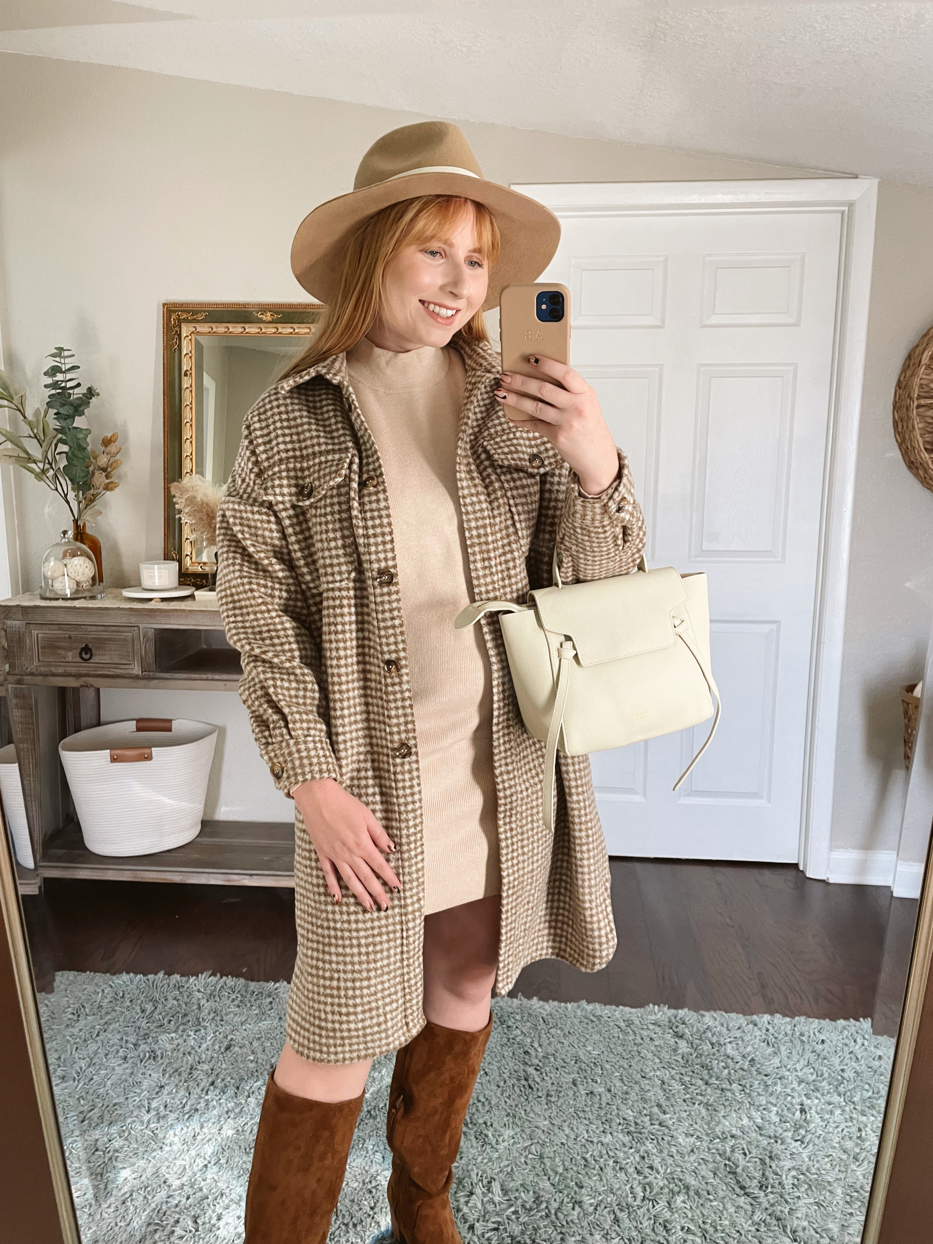 Affordable by Amanda wears a neutral colored sweater dress with a brown houndstooth shirt jacket on top with brown boots | stylish fall outfit ideas