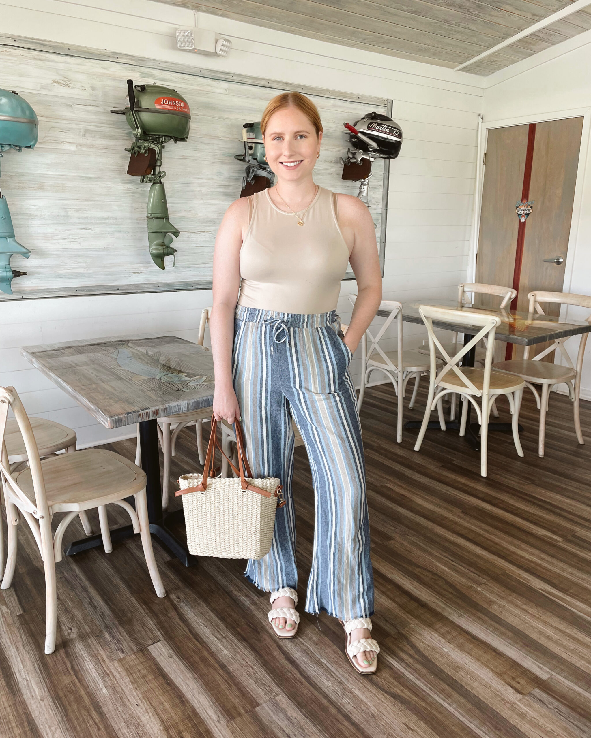 Tan bodysuit, blue and tan striped linen pants, white braided sandals, rattan tote bag - Summer Outfit 2022