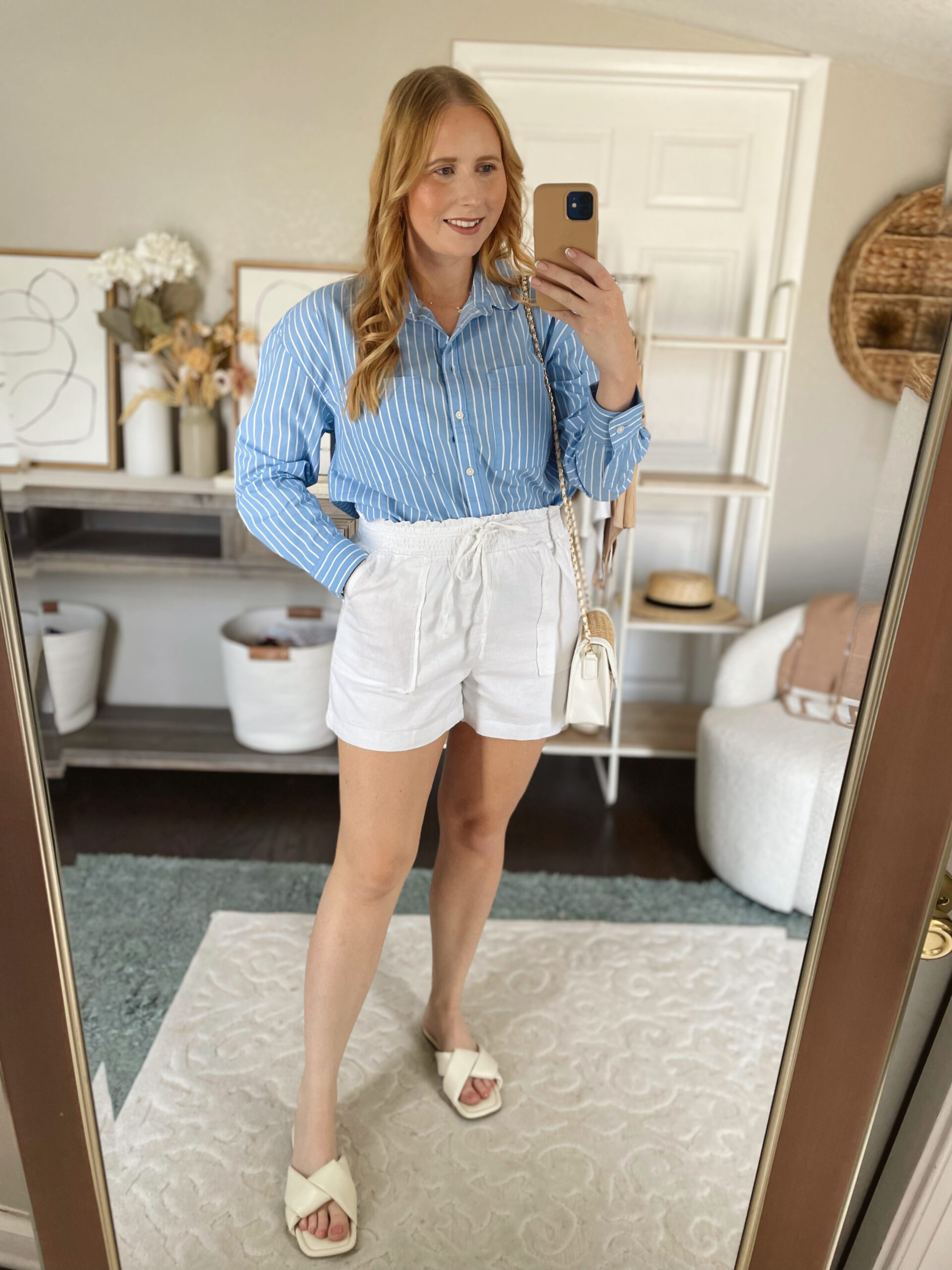 Blue striped button down blouse with white linen shorts 