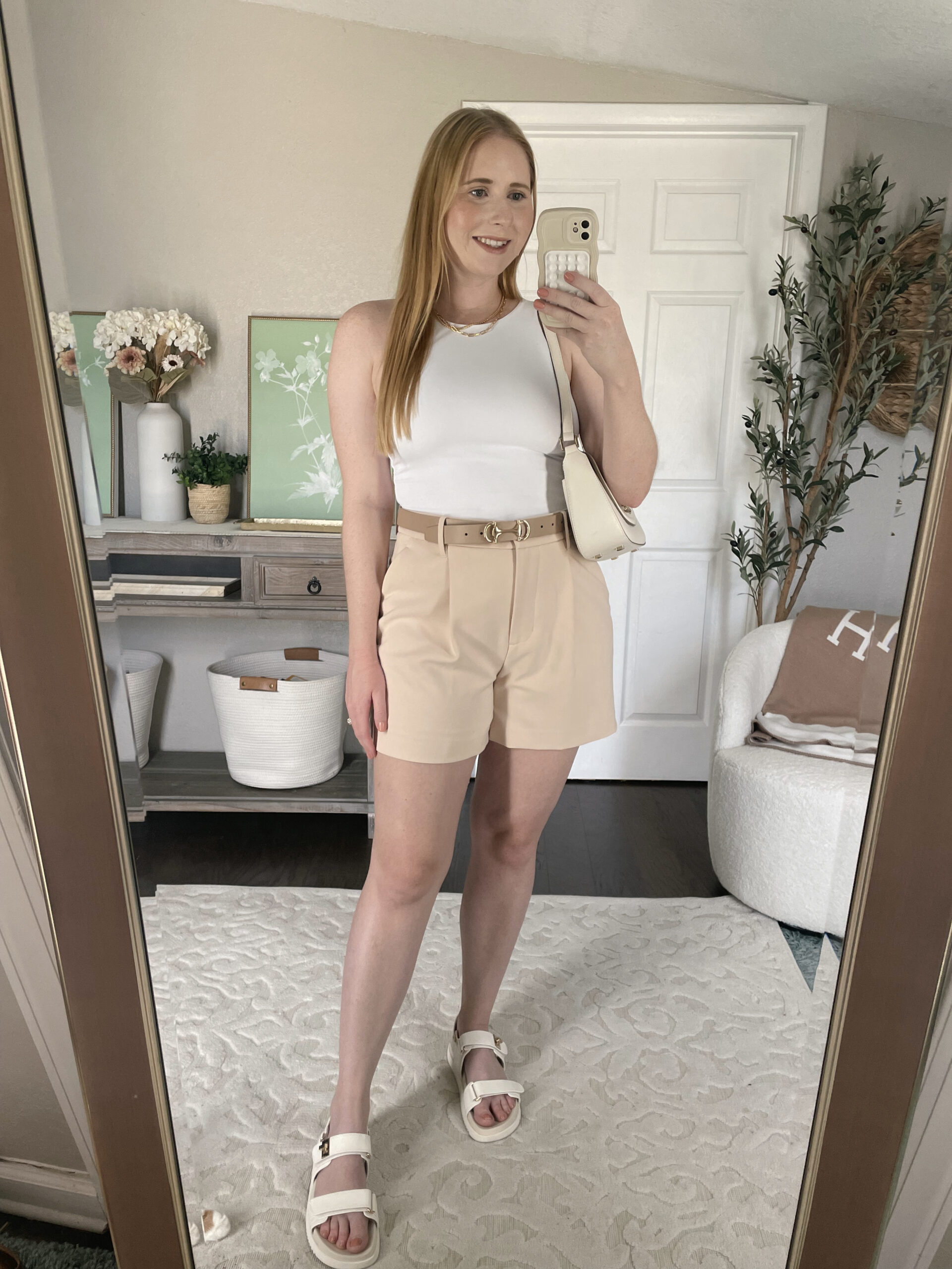 White bodysuit, beige high rise tailored shorts, white ankle strap sandals | How to dress like Sofia Richie for less | Sofia Richie Outfits on Amazon | Sofia Richie Grainge quiet luxury street style