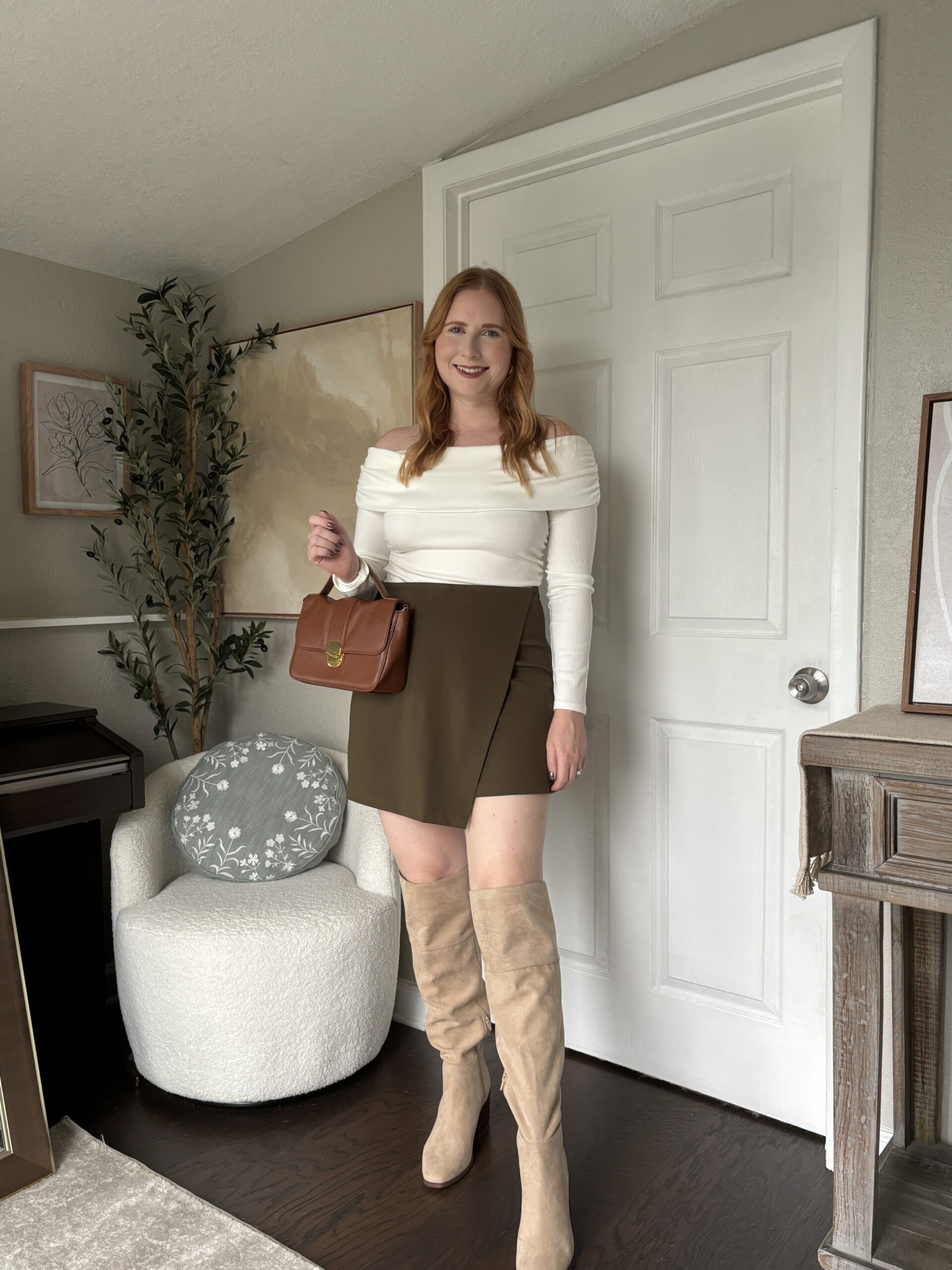 white long sleeve sweater, green mini skirt, tan knee high boots
